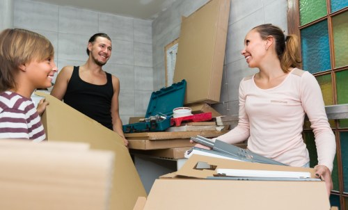 Removal team preparing belongings with safety equipment during a Belsize Park move