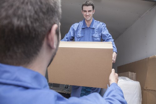 Mover carrying out a careful property assessment before a relocation in Belsize Park