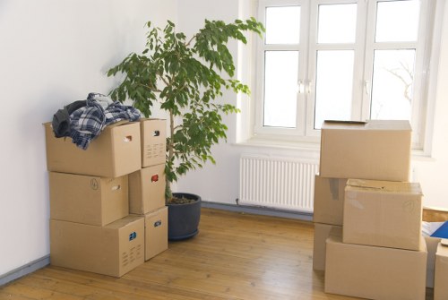 Professional movers loading boxes into a removal van