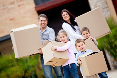 Packed moving boxes and furniture prepared by Belsizepark removal experts