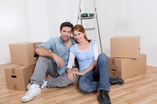 Moving specialists handling furniture and belongings with care