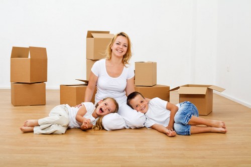 Local movers handling furniture removals in Belsize Park on a residential street